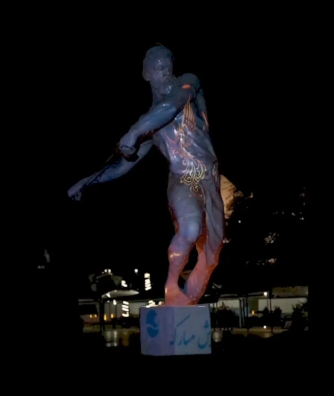 Video mapping projection on a human statue at Kish Island