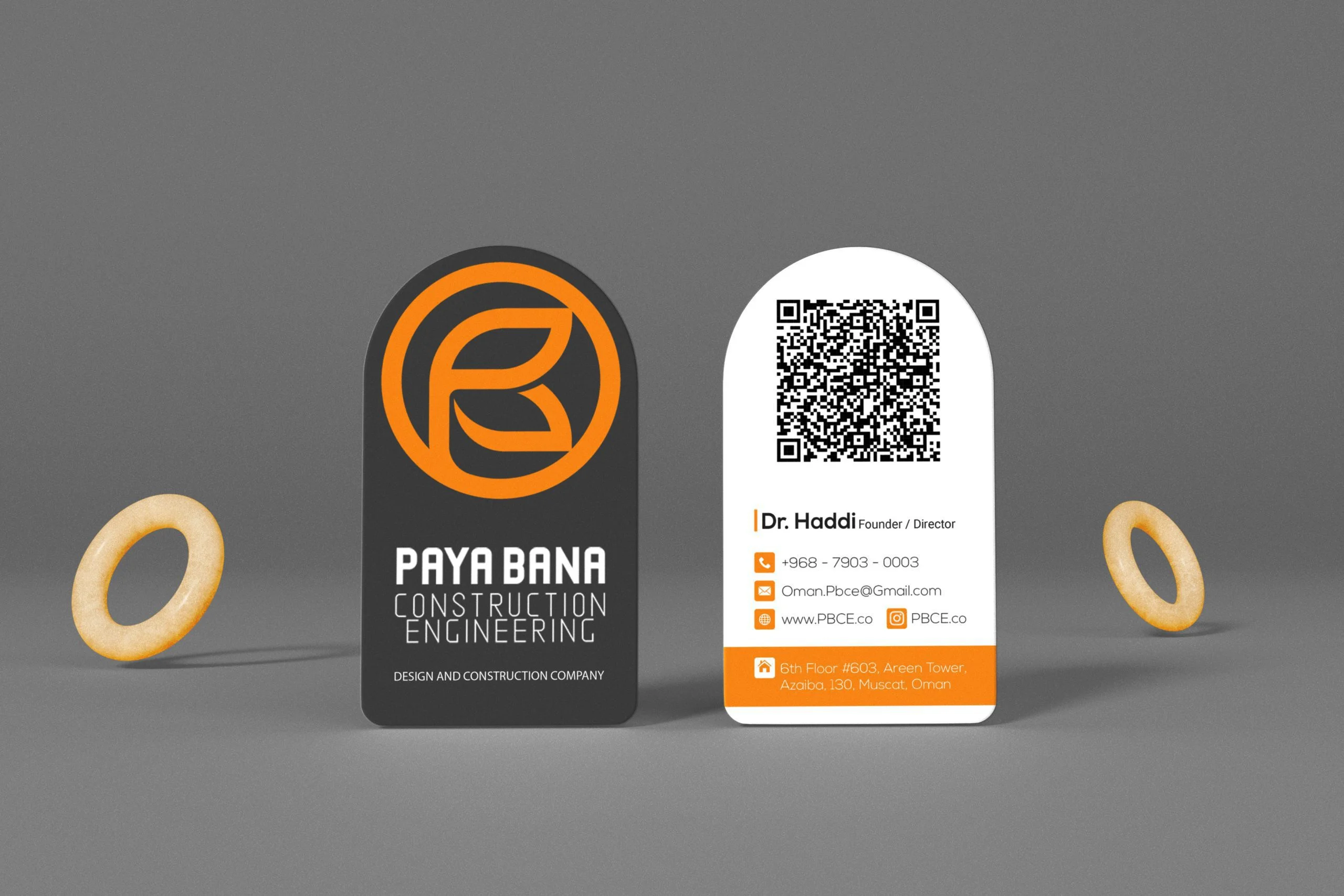 Two arched business cards for PayaBana Co showing the logo and contact details