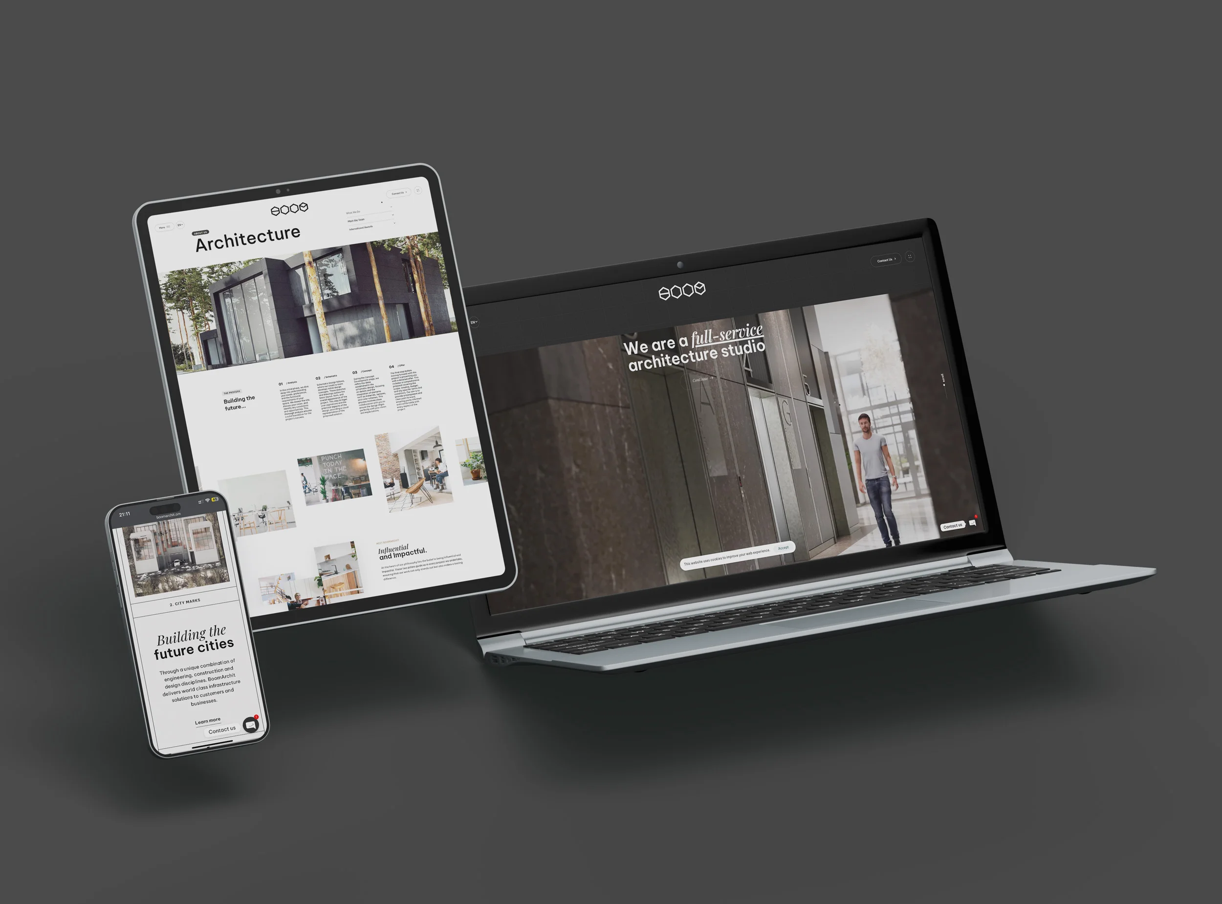 Website UI screenshots of Boom Archit Oman on a laptop, tablet, and smartphone